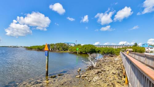 a sign in the water next to a bridge at Aqua Vista Ocean Pointe 3307 in Key Largo