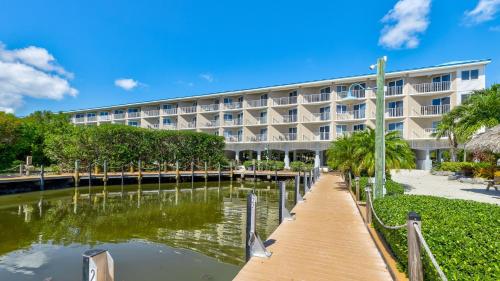 a large building with a canal in front of it at Key Largo Baha Penthouse Ocean Pointe 1416 in Key Largo