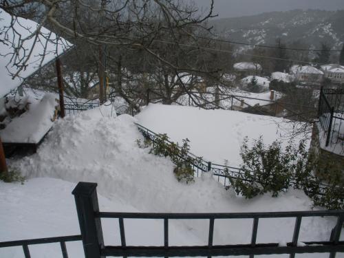 a pile of snow next to a fence at Seirios in Vizitsa