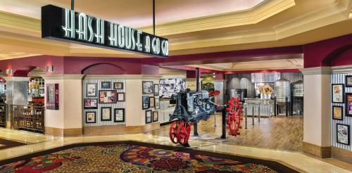 a lobby of a hotel with a exhibit in the center at The LINQ Hotel & Casino, A Caesars Destination in Las Vegas