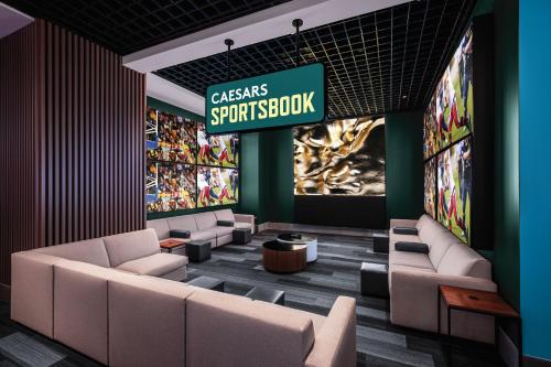 a lobby with couches and a sign that reads classics springbush at The LINQ Hotel & Casino, A Caesars Destination in Las Vegas
