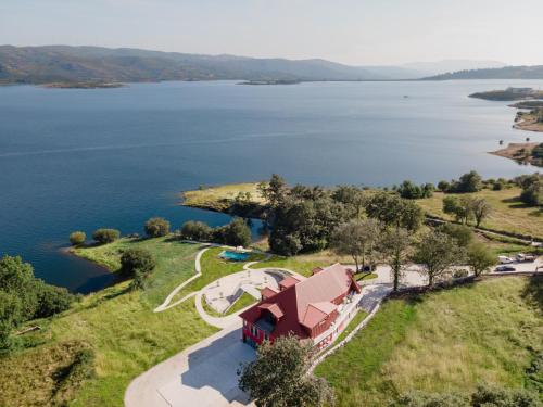 an aerial view of a house with a view of a lake at Belas Vistas Hotel in Montalegre