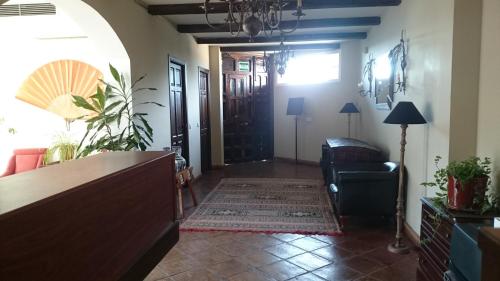 a living room with a large open door at Hotel Rural La Pedriza Original in Manzanares el Real