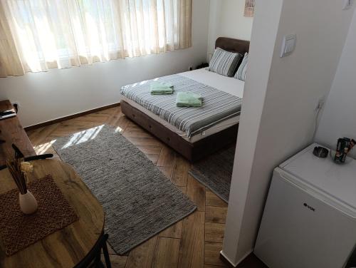 Кровать или кровати в номере Nikolic apartment