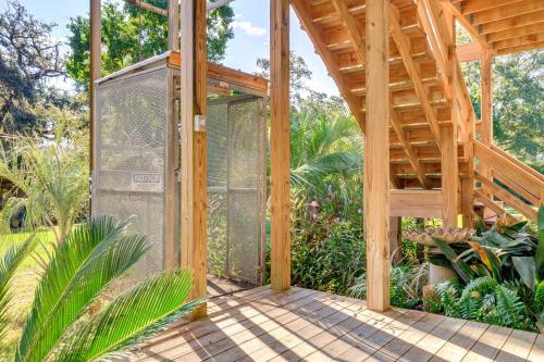 a greenhouse in the middle of a garden at Waterfront Gulf Coast Home with Outdoor Oasis! in Gautier