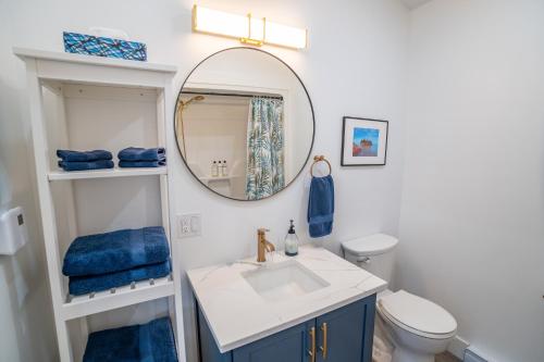 a bathroom with a sink and a mirror at Shangri-La Cottages in Burntcoat