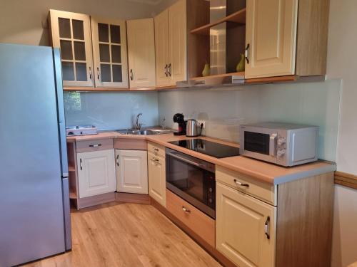 Kuchyň nebo kuchyňský kout v ubytování Neris apartments