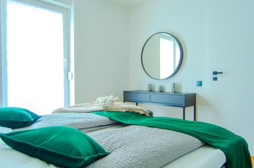 Ένα ή περισσότερα κρεβάτια σε δωμάτιο στο Design trifft Harmonie nahe Triberger Wasserfälle