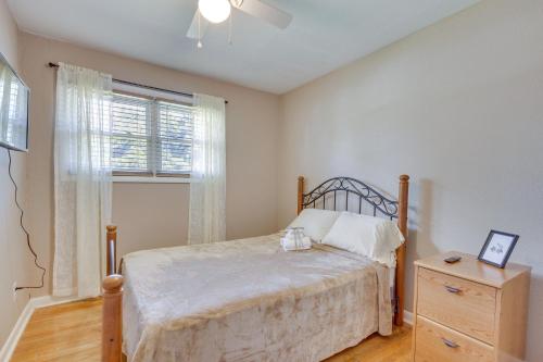 a bedroom with a bed and a window and a dresser at 4 Mi to Dtwn Home with Fenced Yard in Portsmouth! in Portsmouth