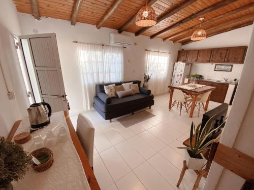 a living room with a couch and a table at HOSPEJADE ESQUINA in Esquina