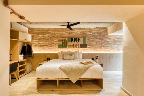 Ένα ή περισσότερα κρεβάτια σε δωμάτιο στο Caliza Roma Residences by Tasman