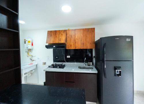 Kuchyň nebo kuchyňský kout v ubytování Piso en el Quindío, apartamento de lujo