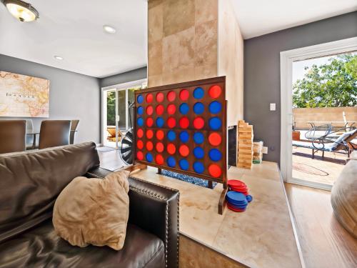 a living room with a giant checker board at Retreat with Pool in Los Angeles