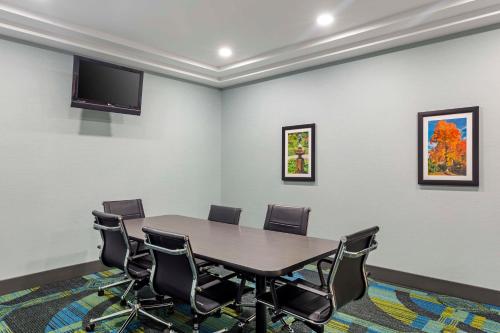 a conference room with a table and chairs at Best Western Plus North Shore Hotel in Danvers
