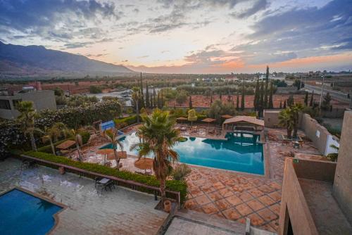 an aerial view of a resort with a swimming pool at RIMALIZ House in Amizmiz