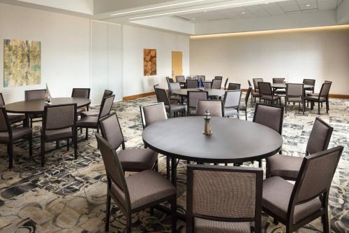 a large room with tables and chairs in it at Courtyard by Marriott Erie Bayfront in Erie