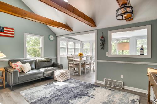 a living room with a couch and a table at Swim and Fish On-Site! Waterfront Cape Cod Cottage in Mashpee