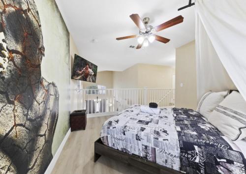 a bedroom with a bed and a ceiling fan at ZEN - A home away from home and in HEART of Las Vegas in Las Vegas