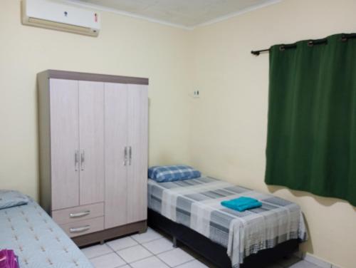 Postel nebo postele na pokoji v ubytování Residencial Andréa House