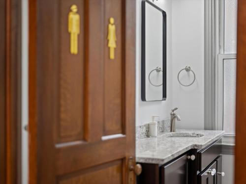 a bathroom with a sink and a mirror at Oakland, Pittsburgh !D Modern and Stylish Private Bedroom with Shared Bathroom in Pittsburgh