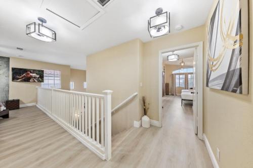a hallway with a staircase and a living room at ZEN - A home away from home and in HEART of Las Vegas in Las Vegas
