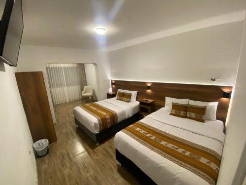 Postel nebo postele na pokoji v ubytování Hotel Rumi
