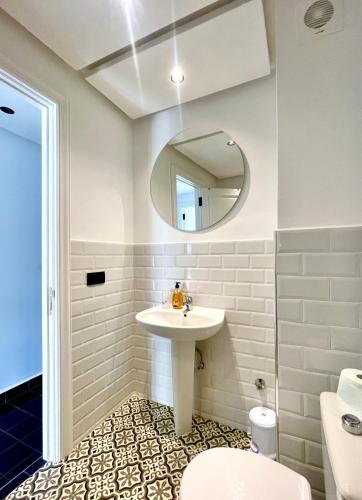 a bathroom with a sink and a mirror at Emeralds House in Tangier