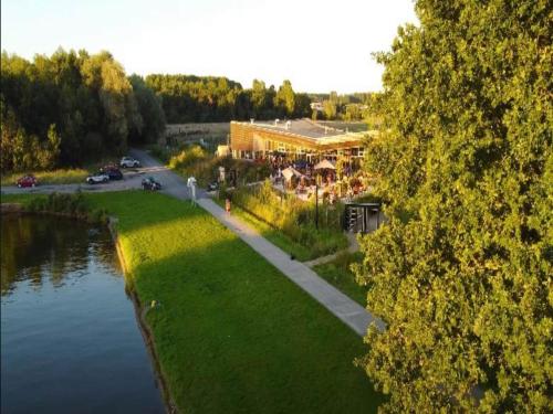 an aerial view of a building next to a river at Charming Antoing Bungalow in Antoing