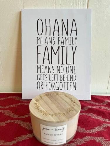 a sign that says omana means family family means no one gets left behind or at YOUR PERFECT HILO HOMEBASE - Sleeps 10 with AC, WD, BBQ in Hilo