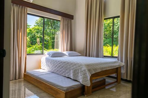 Postel nebo postele na pokoji v ubytování Oro Verde Lodge