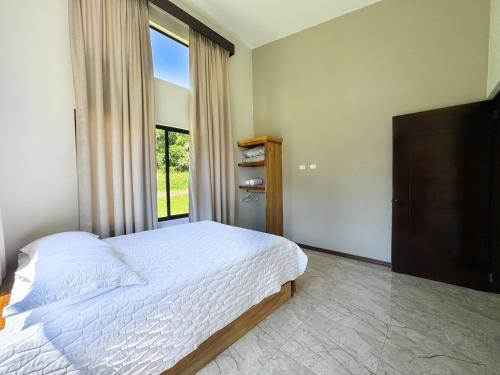 Postel nebo postele na pokoji v ubytování Oro Verde Lodge