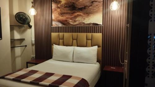 Postel nebo postele na pokoji v ubytování Hotel 50 Suites