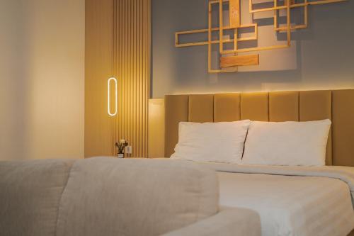 Ένα ή περισσότερα κρεβάτια σε δωμάτιο στο Best Hotel Kedungsari