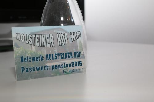 a bottle of detergent with a sign on it at Holsteiner Hof in Heist