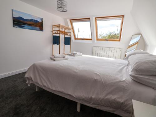 En eller flere senge i et værelse på The Railway Cottage