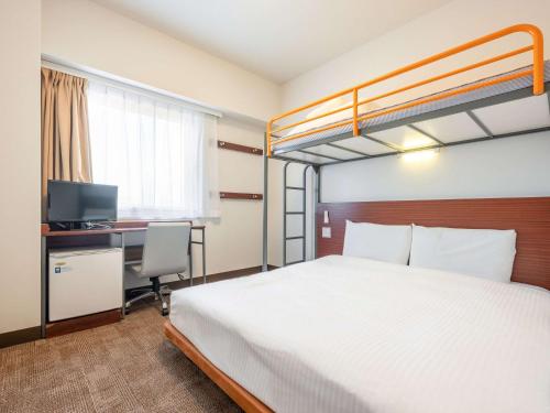 Postel nebo postele na pokoji v ubytování Comfort Inn Fukui