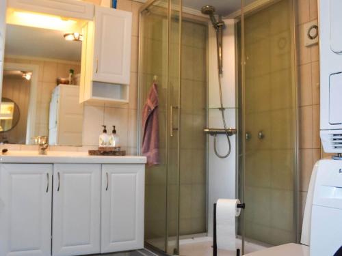 a shower with a glass door in a bathroom at 6 person holiday home in Åram-By Traum in Sandvik