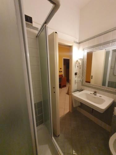 a bathroom with a sink and a mirror at La Lanterna in Silvi Marina