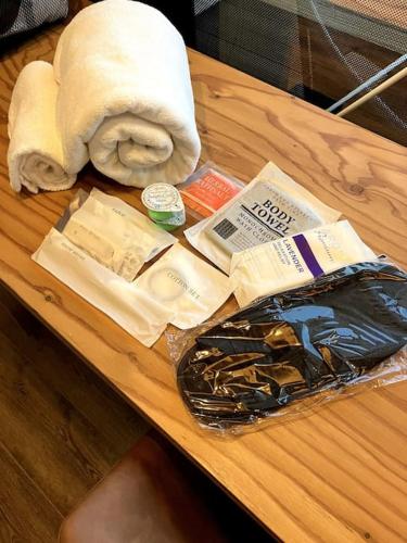 a table with a towel and some food on it at ZABOCON YOICHI Villa in Yoichi
