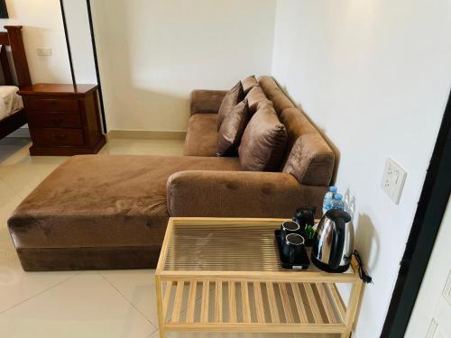a living room with a couch and a coffee table at Boomerang Village Resort Kata in Kata Beach