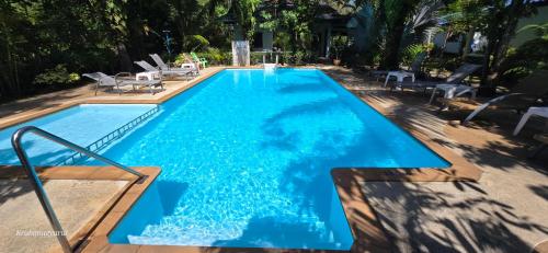a swimming pool with blue water in a yard at Sabai Resort in Ao Nang Beach