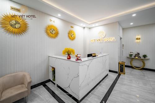a lobby of a hotel with a reception desk at Nét Việt Hotel Vincom Sóc Trăng in Soc Trang