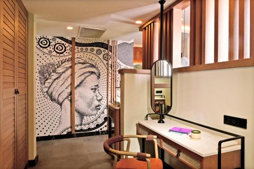 a room with a desk and a wall with a picture at Ethno Belek in Belek
