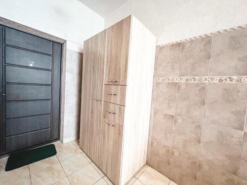 a walk in closet with a large wooden door at Dream Apartments in Kyiv