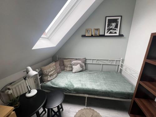 a bedroom with a bed in a attic at 3 Zimmer Monteurewohnung in Kirchhain in Kirchhain