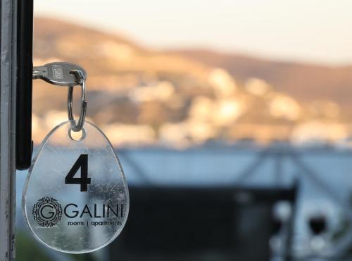 a door tag with the number four on it at Galini Rooms & Apartments in Finikas