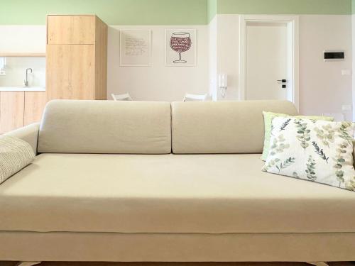 a couch in a living room with a pillow on it at Cozy Nest Golem in Golem