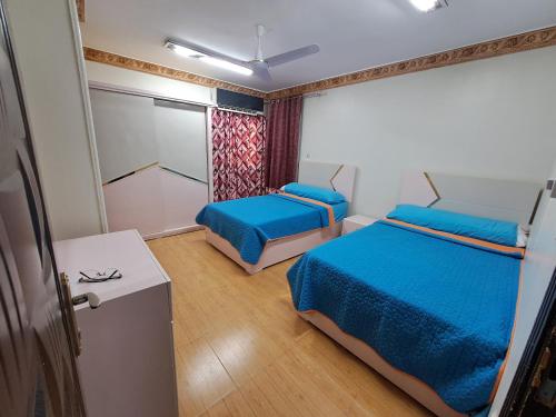 Ένα ή περισσότερα κρεβάτια σε δωμάτιο στο Nile Bride