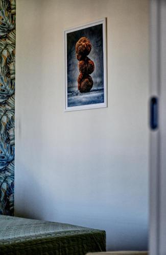 a picture of a stack of teddy bears on a wall at Dimora il Tartufo Relax e Benessere con Spa Privata in Busso