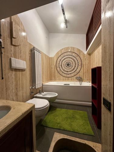 a bathroom with a toilet and a tub and a sink at Borgo De' Paolis in Grottaferrata